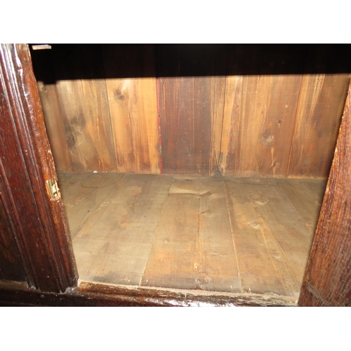 4117 - A Circa 1700 English pegged oak court cupboard with unusual bank of nine cupboard panelled doors hav... 