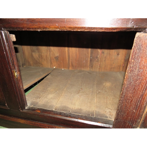 4117 - A Circa 1700 English pegged oak court cupboard with unusual bank of nine cupboard panelled doors hav... 