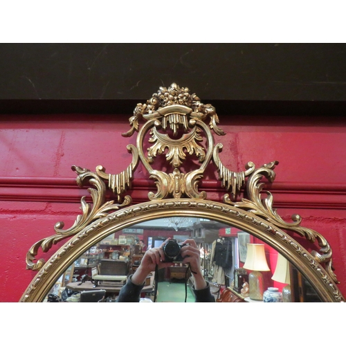 4118 - A gilt classical style wall mirror with scrolled foliate design, 107cm x 70cm total