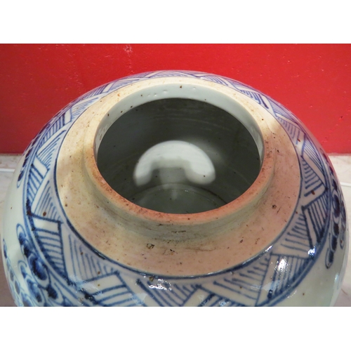 4132 - A Chinese bulbous blue and white ginger jar and cover, 26cm high