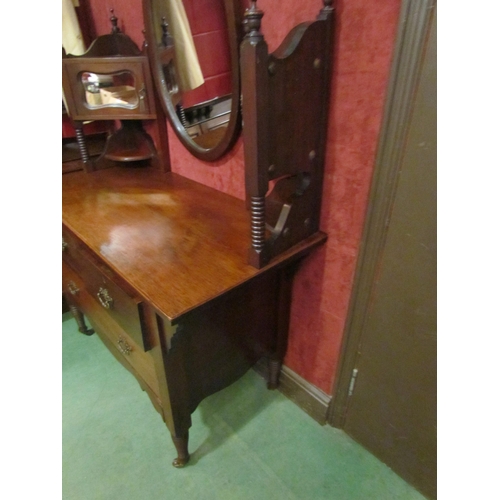 4180 - Circa 1890 an Arts & Crafts walnut dressing chest, the finial raised back with central oval mirror a... 