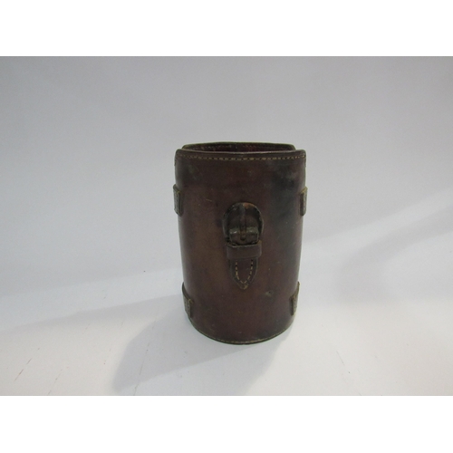 4310 - A set of three silver hunting cups in leather container, a/f