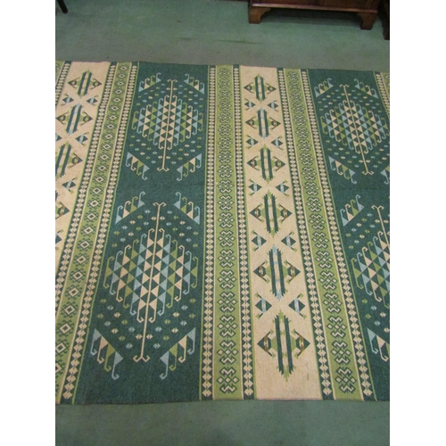 4409 - A green and cream Kilim rug decorated with geometric patterns, tasselled ends, 300cm x 200cm    (E) ... 