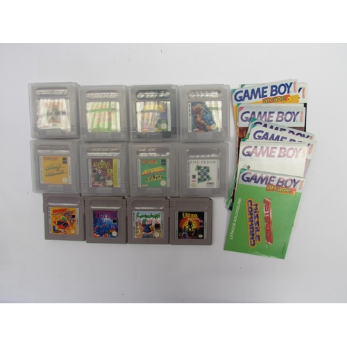 7024 - Twelve Nintendo Game Boy games and manuals to include Ultima Runes of Virtue, Lemmings, Arcade Class... 