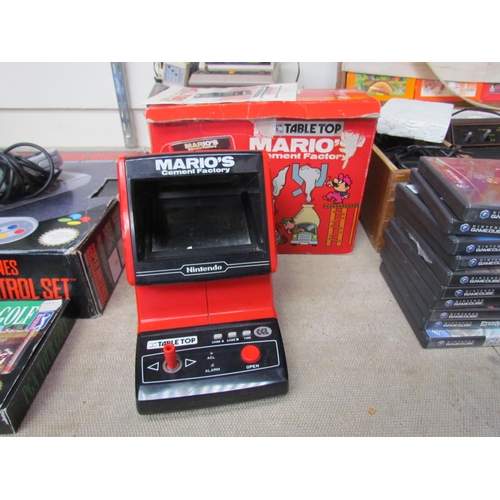 7030 - A boxed Nintendo Mario's Cement Factory Table Top Game & Watch electronic game