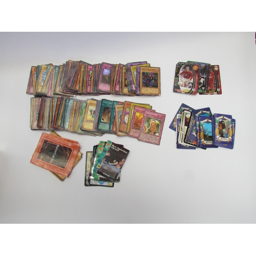 7041 - Approximately 200 Yu-Gi-Oh trading cards including some holographic cards together with a small quan... 