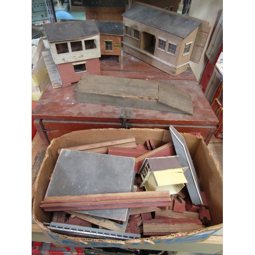 7383 - A pine box containing 0 gauge model railway track, together with wooden lineside buildings and platf... 