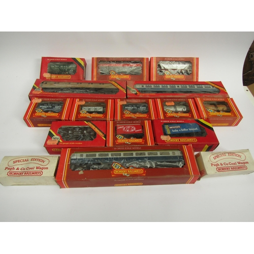 7424 - A collection of boxed Hornby model railway 00 gauge rolling stock coaches and wagons and a Colour Li... 