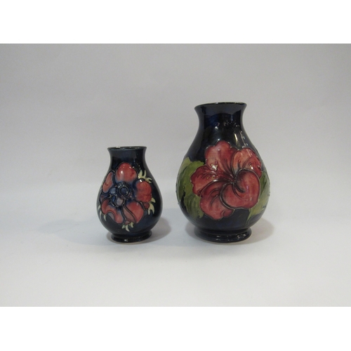 4234 - Two Moorcroft vases, one bearing paper stamp By Appointment to The Late Queen Mary, 10cm tall and 15... 