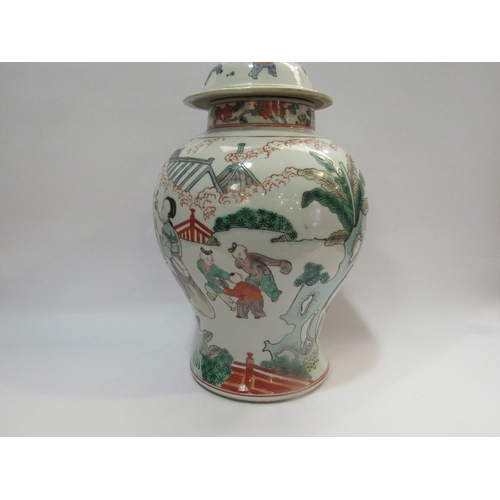 4260 - A Chinese vase with cover depicting women with children playing, character mark to base, 40.5cm high