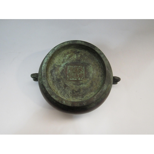 4266 - A bronze two handled censor with elephant handles and character marks