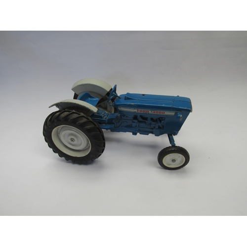 7213 - A playworn diecast Ford 4000 tractor