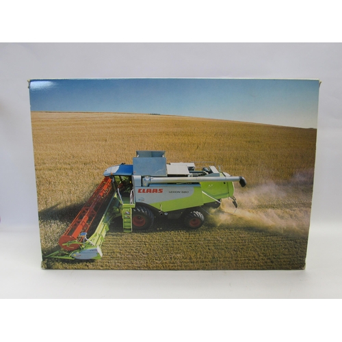 7239 - A boxed Norscot 1:32 scale diecast Claas Lexion 580 combine harvester