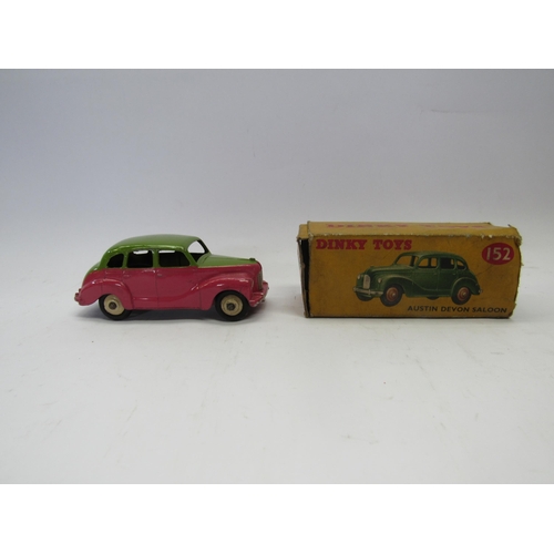 7279 - A boxed Dinky Toys diecast 152 (40d) Austin Devon Saloon in green and pink wih beige hubs, box missi... 