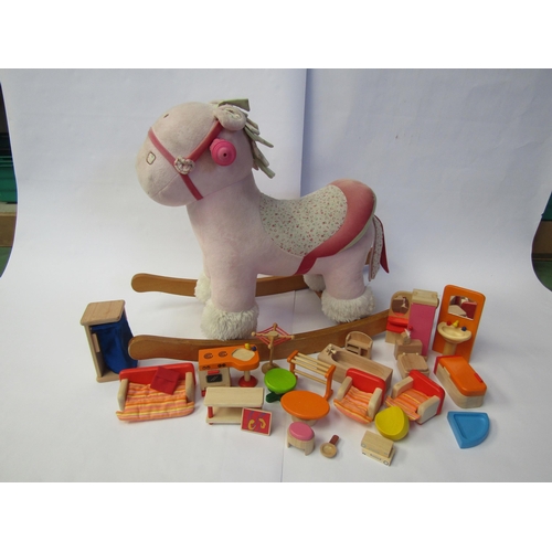 7090 - A soft filled rocking horse and a collection of Pintoy wooden dolls house furniture