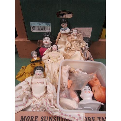 7097 - A collection of china head and shoulder dolls and assorted doll parts