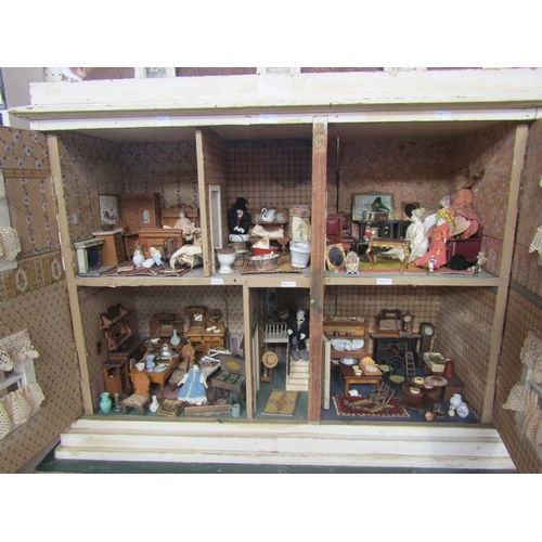 7125 - A Georgian townhouse style two storey dolls house with a good quantity of furniture, 88cm tall x 88c... 