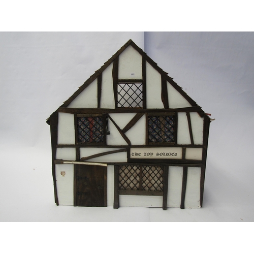 7134 - A wooden two storey dolls house as 'The Toy Soldier' pub, with assorted furniture and accessories, 4... 