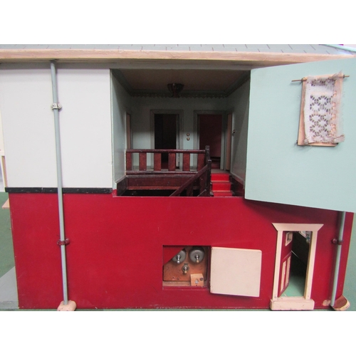 7136 - A painted wooden two storey dolls house as a 1930's detached house with assorted furniture and acces... 