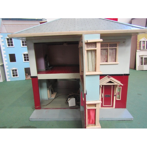 7136 - A painted wooden two storey dolls house as a 1930's detached house with assorted furniture and acces... 