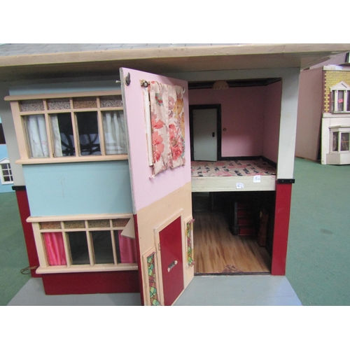 7136 - A painted wooden two storey dolls house as a 1930's detached house with assorted furniture and acces... 