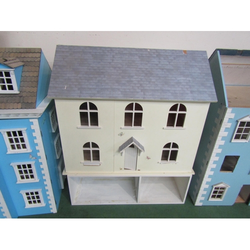 7138 - A two storey dolls house with basement below, 83cm tall (including basement) x 70cm wide x 38cm deep... 