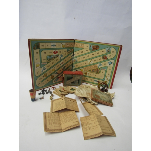 7168 - A small group of late 19th / early 20th Century toys and games including gyroscope toy, Cycling game... 