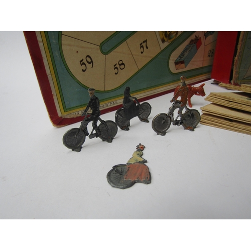 7168 - A small group of late 19th / early 20th Century toys and games including gyroscope toy, Cycling game... 