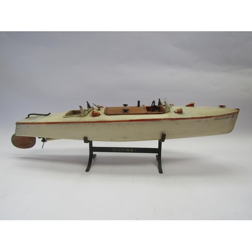 7367 - A playworn Hornby Racer III clockwork tinplate boat on wrought metal Hornby stand