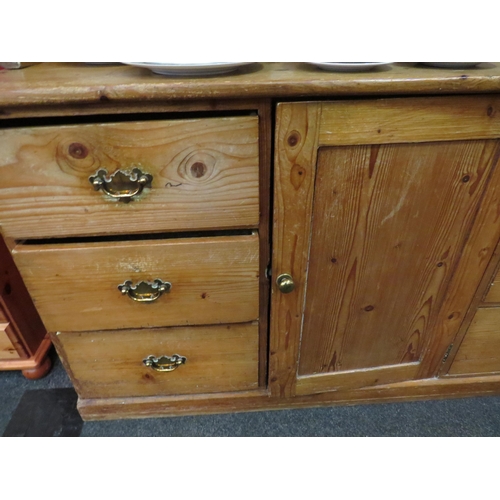 1078 - A Victorian pine dresser base with later plate rack, 180cm high x 153cm wide x 57cm deep