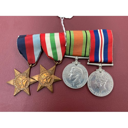 5378 - A WWII medal group of four consisting of 1939-45 and Italy Stars, Defence Medal and War Medal. An El... 