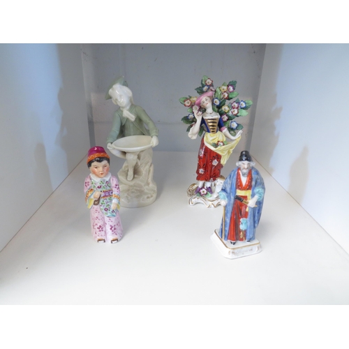 1430 - Four porcelain figures including Staffordshire style lady