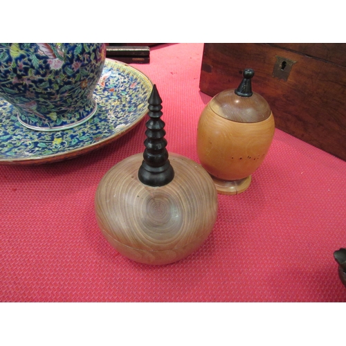 1533 - Two turned wooden lidded pots with ebonised finials