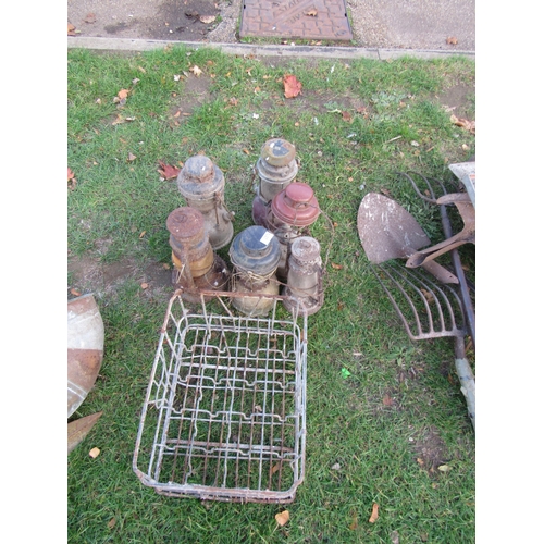 3574 - A bygone bottle crate and a quantity of Tilley style lanterns