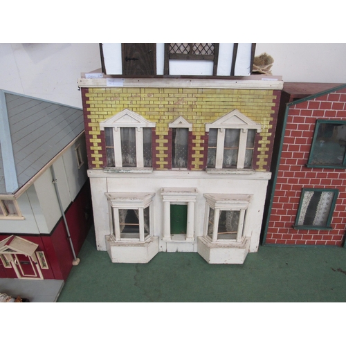 7135 - A Georgian townhouse style two storey dolls house with a good quantity of furniture and accessories,... 