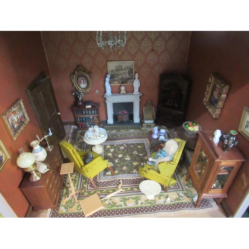 7135 - A Georgian townhouse style two storey dolls house with a good quantity of furniture and accessories,... 