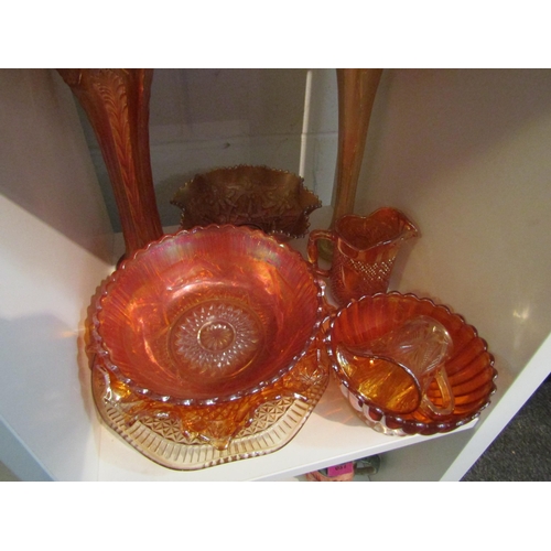 1005 - Nine pieces of orange carnival glass including two vases, bowls, dishes and jugs