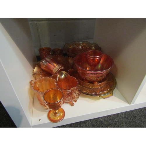 1008 - Fourteen pieces of orange carnival glass including pedestal bowl, jugs, wine glasses etc