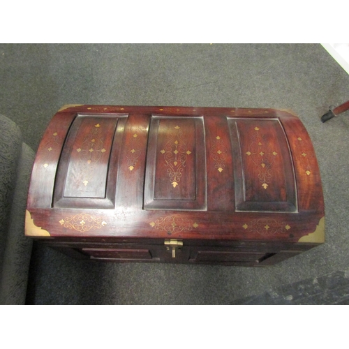 1026 - A Middle Eastern hardwood domed chest with brass inlaid decoration