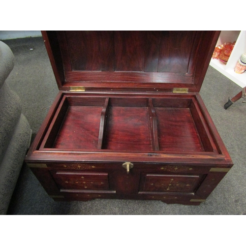 1026 - A Middle Eastern hardwood domed chest with brass inlaid decoration