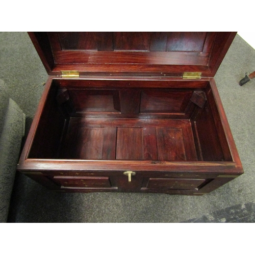 1026 - A Middle Eastern hardwood domed chest with brass inlaid decoration