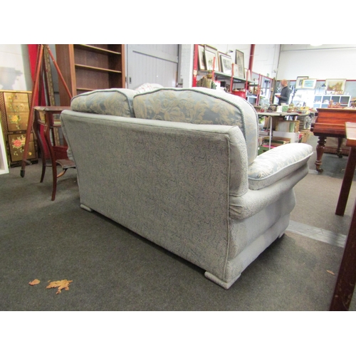 1027 - A classic style two seater sofa, rope trim, loose cushions, pale blue floral upholstery, Life Style ... 