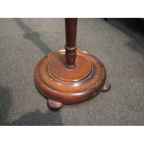 1028 - A wooden standard lamp