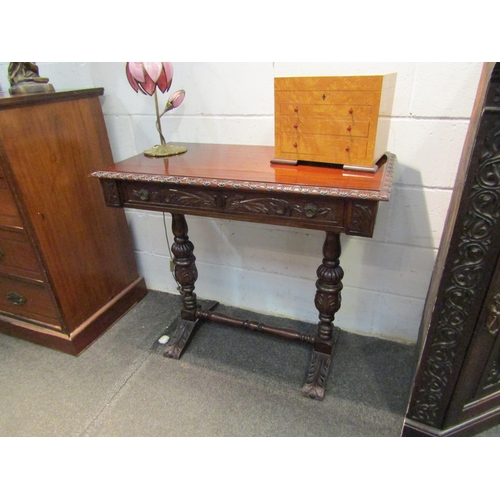 1035 - A Maltese mahogany side table, foliate carved throughout, single frieze drawer, cup and cover suppor... 