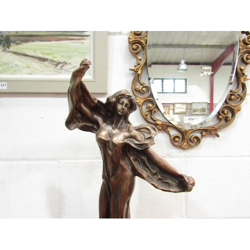 1038 - A bronze hollow cast Art Nouveau figure of maiden, 59cm high