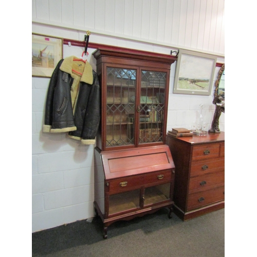 1045 - A Victorian bureau bookcase, lower cabinets having parquet base and bevel edged glass doors, upper b... 