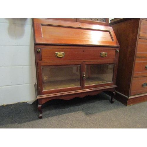 1045 - A Victorian bureau bookcase, lower cabinets having parquet base and bevel edged glass doors, upper b... 