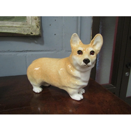 1051 - A Winstanley figure of a Corgi with glass eyes, No. 4 to base, 21.5cm