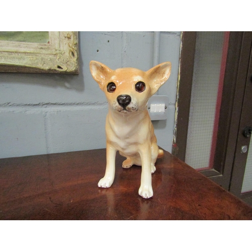 1052 - A Winstanley figure of a chihuahua with glass eyes, No. 4 to base, 24cm high