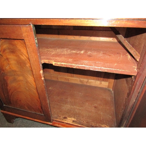 1054 - An early Victorian mahogany cabinet, the two drawers over two cupboard doors, bracket supports, some... 